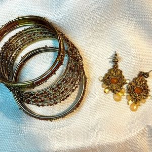 Gold colored bangles and earrings. Earring missing one gemstone as pictured